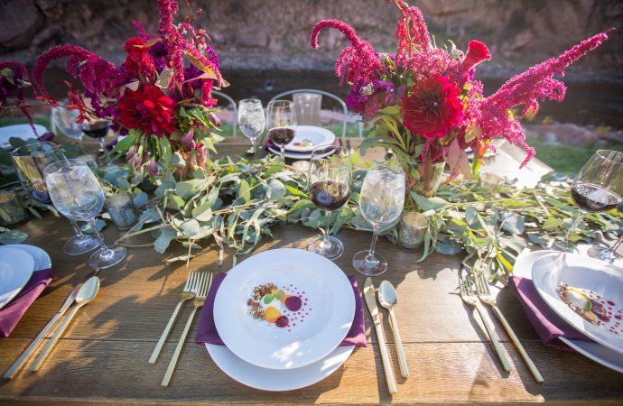 decorated dinner table with flowers and food