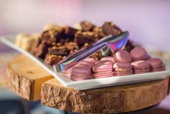 Array of deserts including macarons and brownies