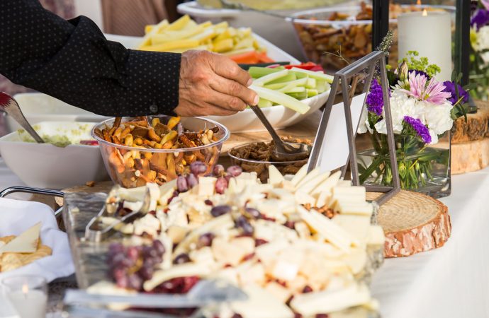 Person serving themselves from buffet