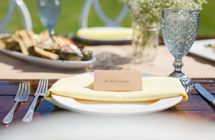 Name card on decorated table setting outdoors