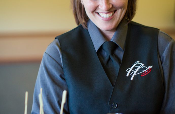 caterer holding a tray of food