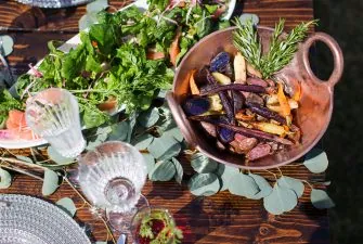 bowl of vegetables and salad on a table