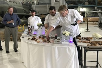 Biscuits and Berries staff decorates a specialty desert station