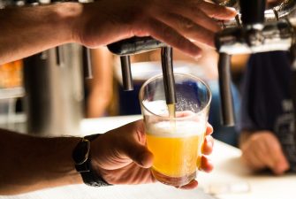 Bartending pouring a beer