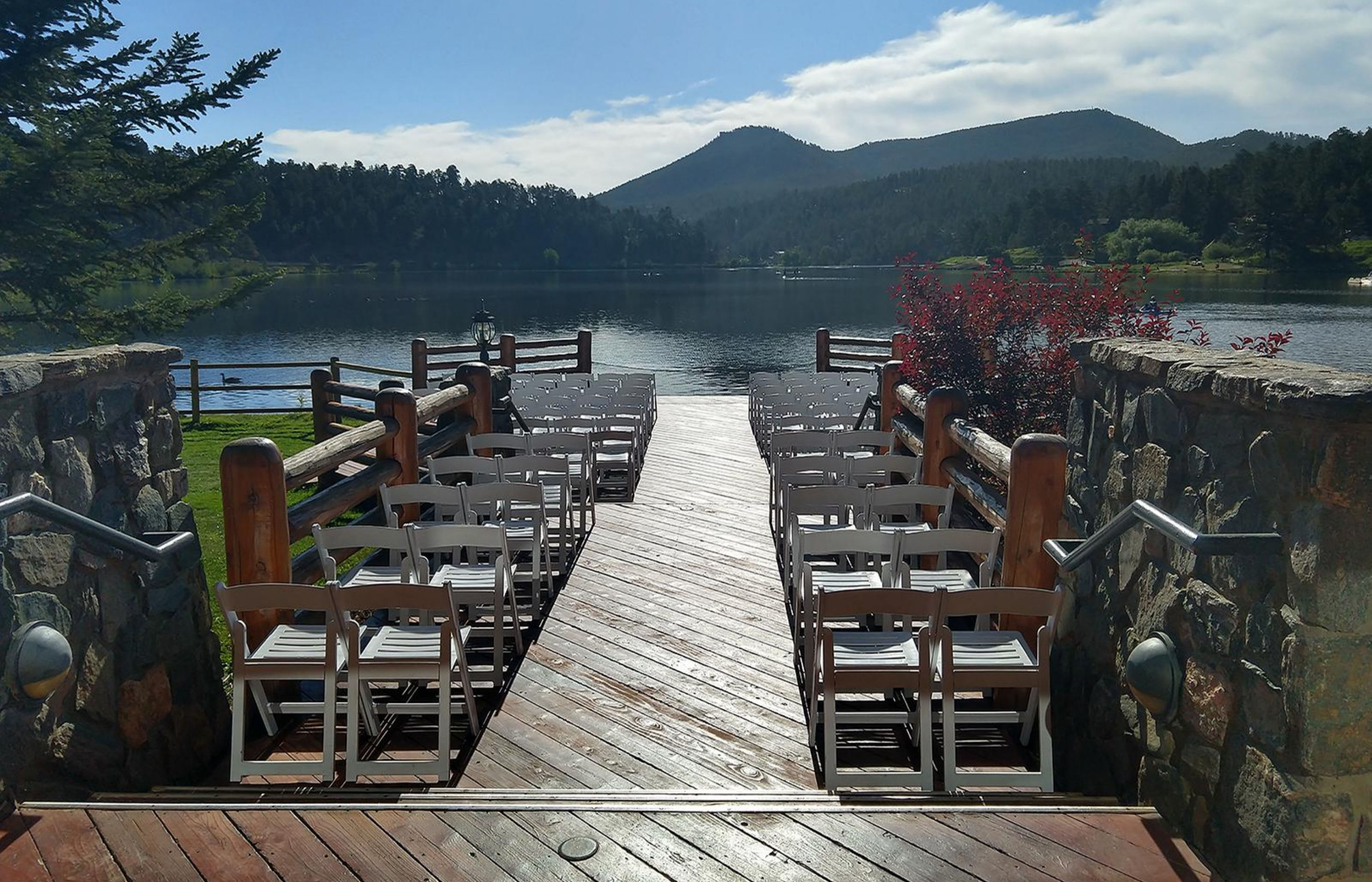 Rows of chairs facing a lake for a wedding ceremony