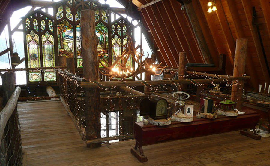 Upper level of barn with stained glass triptych