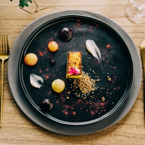 modern, contemporary food arrangement on dark plate