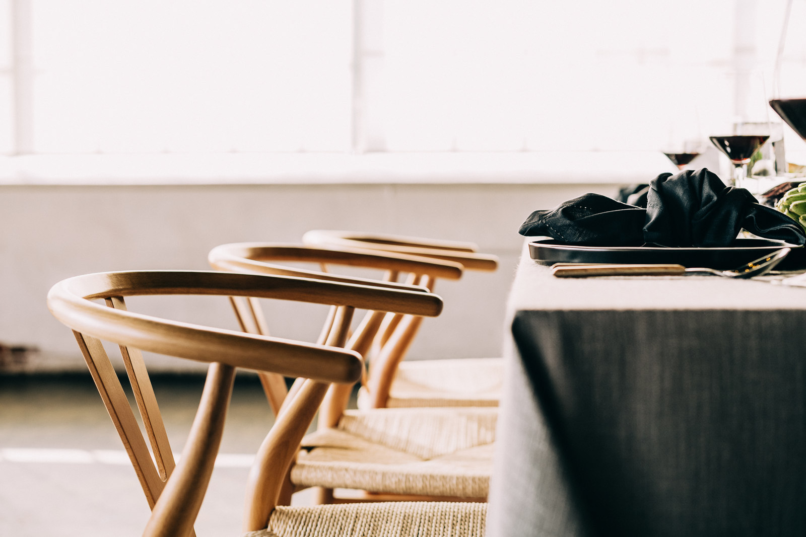 close up of 3 chairs at a set table