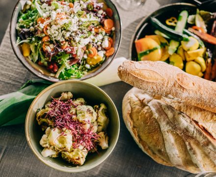 overhead shot spread of bread and salads