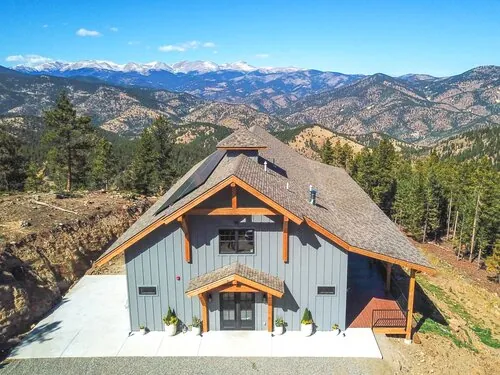 Large Barn surrounded by mountains